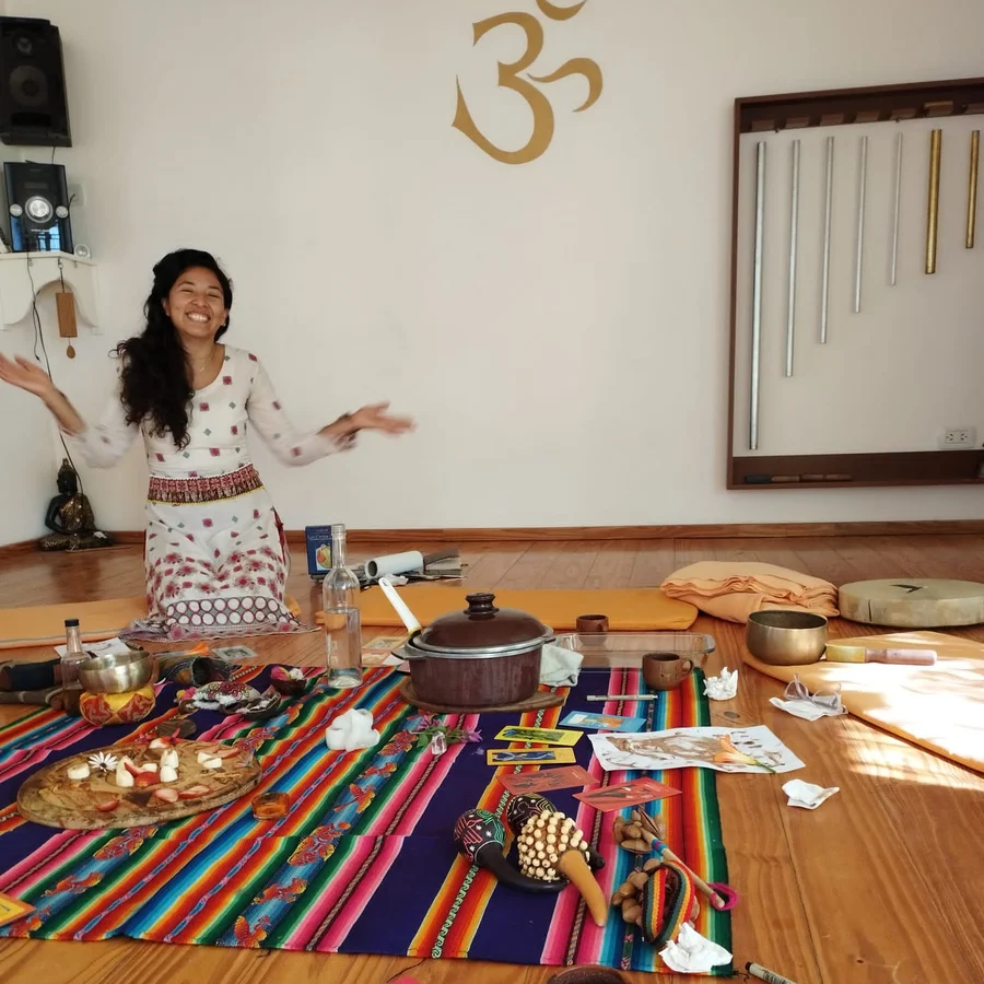 Mar with candle offering at her mesa — preparing for the Ceremony of Cacao