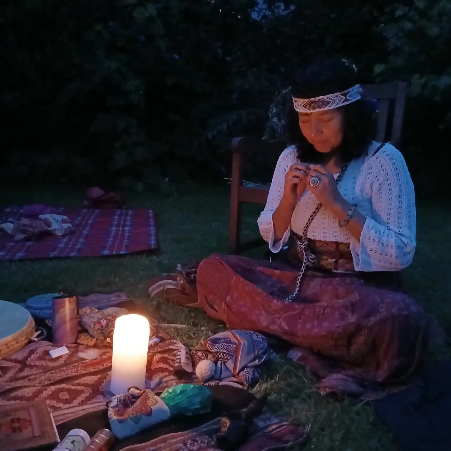 Mar at her candlelit mesa in the garden at night — meditative